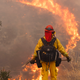 Firefighters tackle the blaze in Santa Clarita. (EPA/Eugene Garcia)